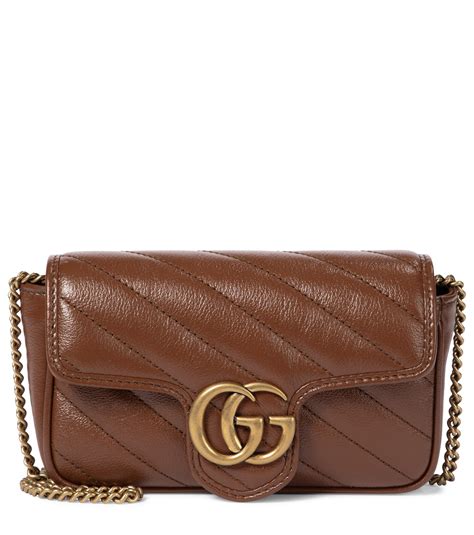 brown gucci mini bag with green dragon on it|GG Emblem super mini bag in pale green leather .